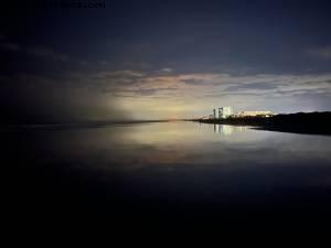 Walking on the beach by night - Cocoa Beach, Florida